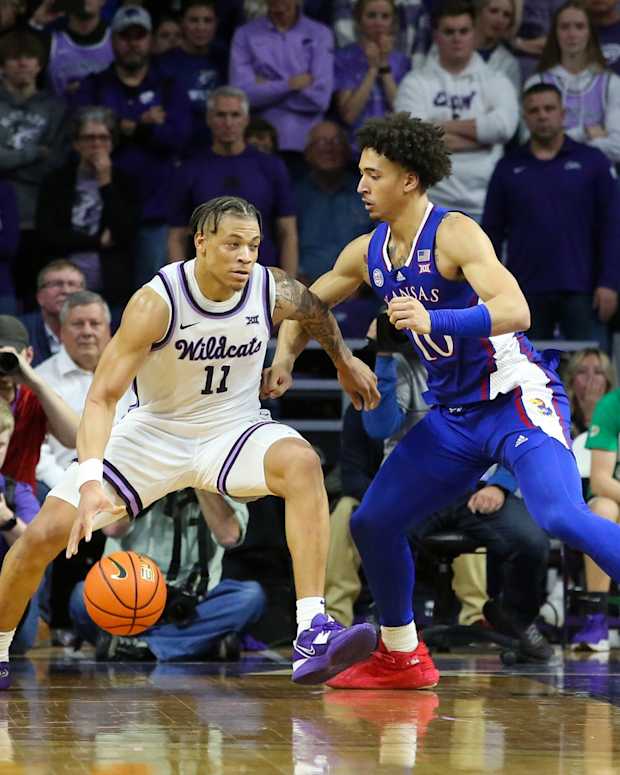 Kansas forward Jalen Wilson defends Kansas State guard Keyontae Johnson